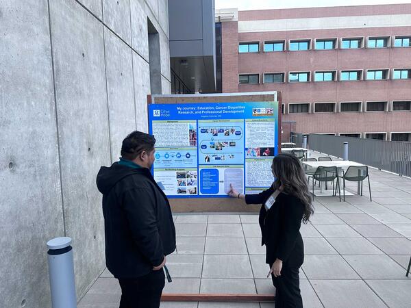 Students looking at poster board